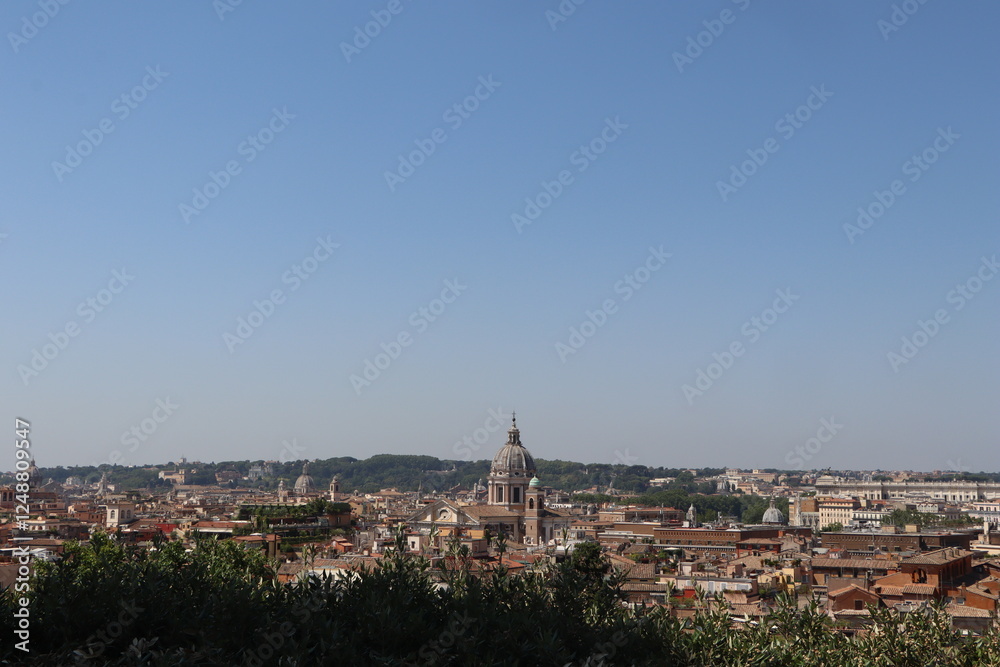 Fototapeta premium Panoramic view of Rome with historic buildings, domes, and a clear blue sky, showcasing the city's architectural beauty and rich cultural heritage