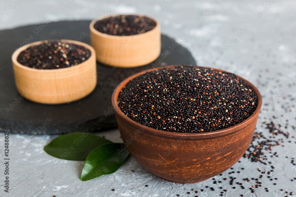 quinoa seeds in bowl on colored background. Healthy kinwa in small bowl. Healthy superfood quinoa seeds in bowl on colored background. Healthy kinwa in small bowl. Healthy superfood