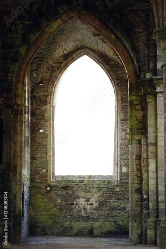 High arched windows with tracery in an abandoned Gothic building