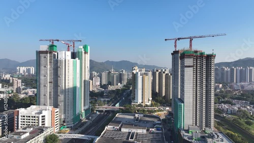 Explore the aerial view of urban development in Fanling Sheung Shui near  Lo Wu Hong Kong Shenzhen, where large tracts of farmland are being redeveloped into residential housing to address population  photo