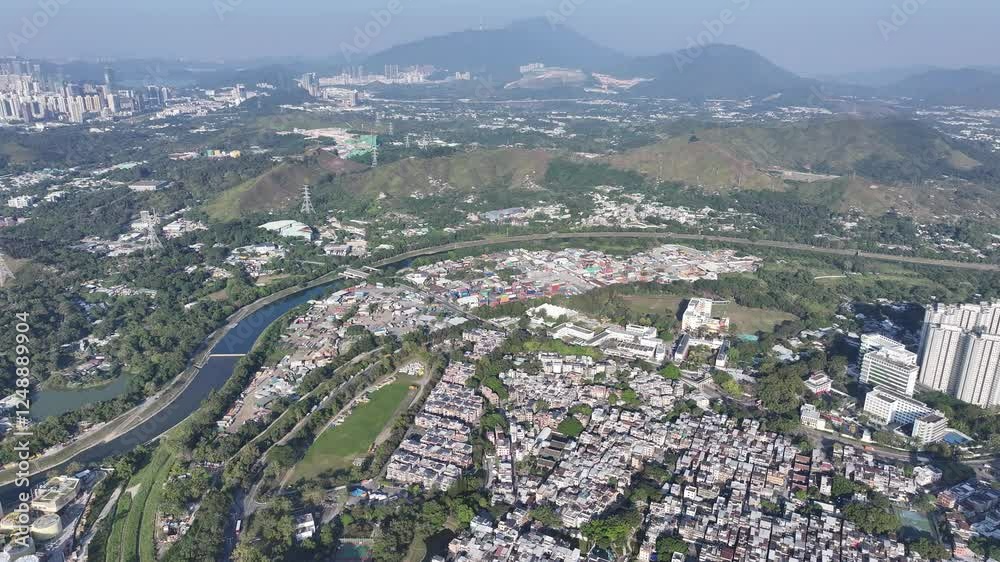 Explore the aerial view of urban development in Fanling Sheung Shui near Lo Wu Hong Kong Shenzhen, where large tracts of farmland are being redeveloped into residential housing to address population Explore the aerial view of urban development in Fanling Sheung Shui near Lo Wu Hong Kong Shenzhen, where large tracts of farmland are being redeveloped into residential housing to address population