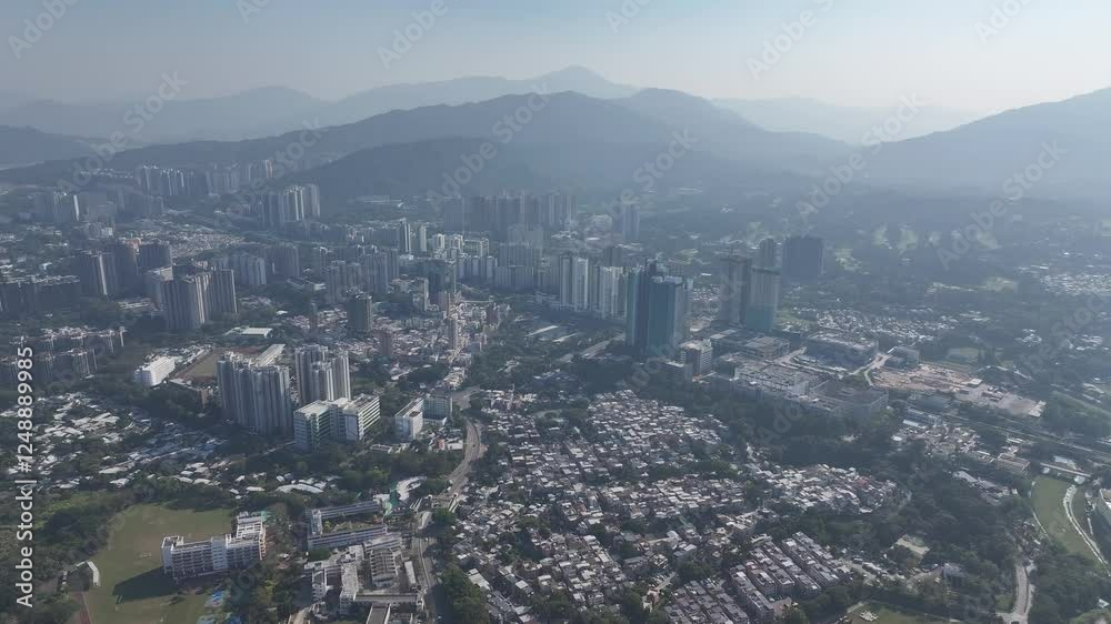 Explore the aerial view of urban development in Fanling Sheung Shui near Lo Wu Hong Kong Shenzhen, where large tracts of farmland are being redeveloped into residential housing to address population Explore the aerial view of urban development in Fanling Sheung Shui near Lo Wu Hong Kong Shenzhen, where large tracts of farmland are being redeveloped into residential housing to address population