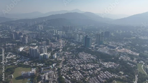 Explore the aerial view of urban development in Fanling Sheung Shui near  Lo Wu Hong Kong Shenzhen, where large tracts of farmland are being redeveloped into residential housing to address population  photo