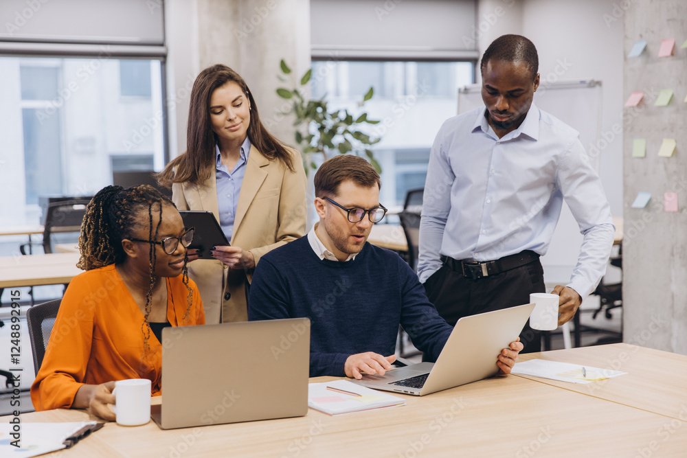 Professional team collaborating in modern workplace, sharing ideas and strategizing toward shared corporate objectives Professional team collaborating in modern workplace, sharing ideas and strategizing toward shared corporate objectives