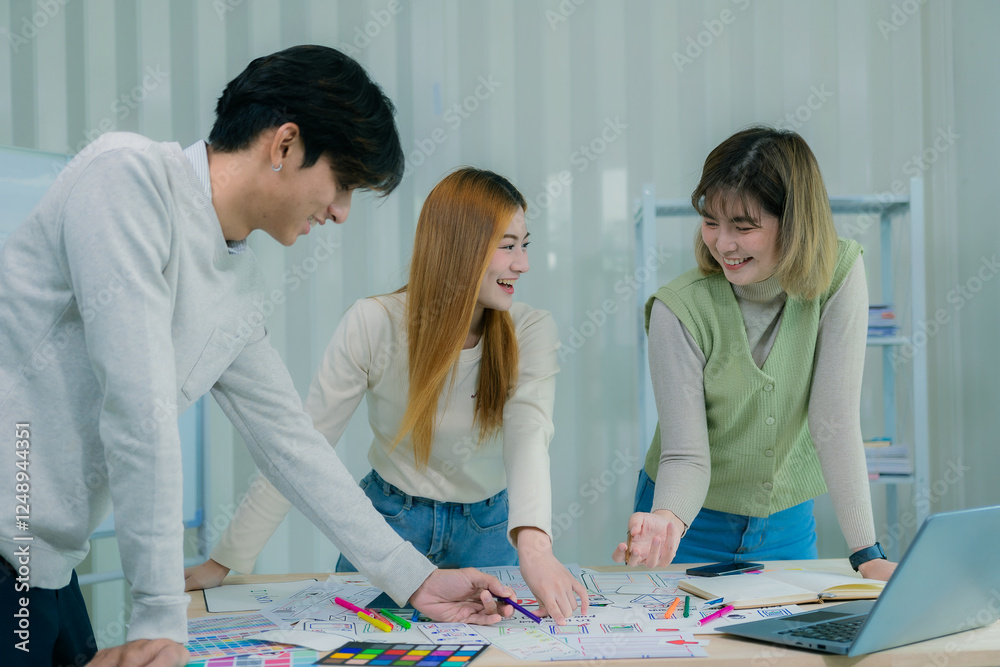 Fototapeta premium UX/UI designers discuss and brainstorm layouts for websites and mobile app prototypes. in website and mobile application design concepts
