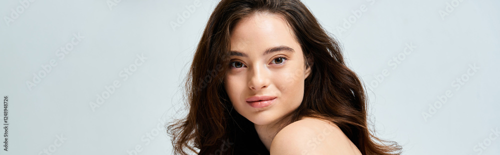 Captivating young woman with soft smile and flowing hair enjoying a tranquil moment indoors Captivating young woman with soft smile and flowing hair enjoying a tranquil moment indoors