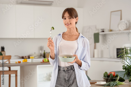 Young woman with vegetable ...