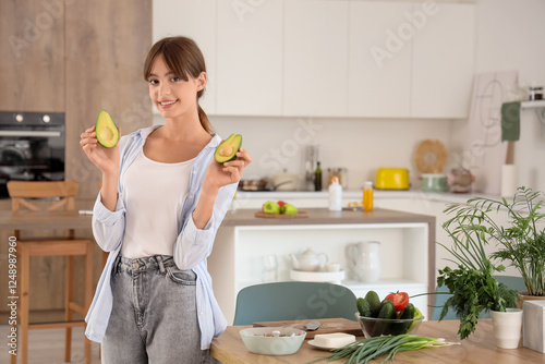 Smiling young woman holding...