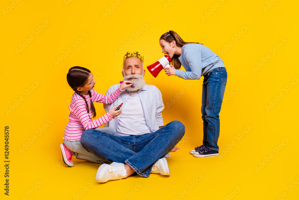Grandfather Bonding with Granddaughters Over Fun Activities Against a Vibrant Yellow Background Grandfather Bonding with Granddaughters Over Fun Activities Against a Vibrant Yellow Background