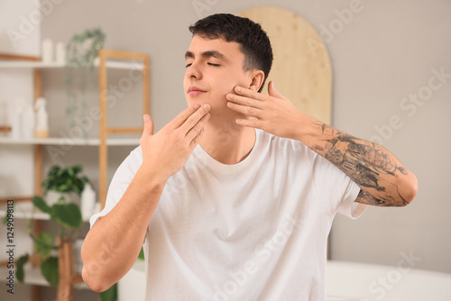 Young man doing face buildi...