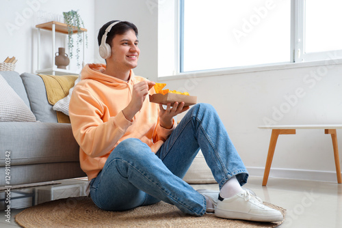 Young man listening to musi...