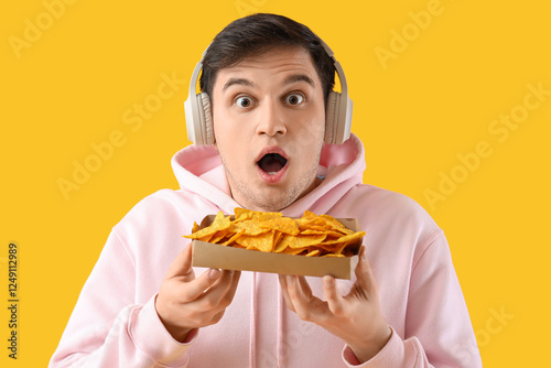 Surprised young man with ta...