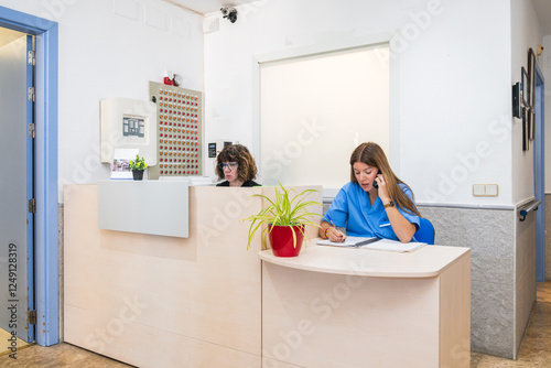 Nurses managing reception desk in nursing home