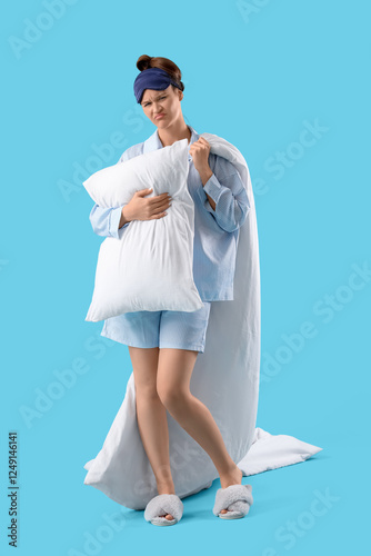 Upset young woman in pajama...