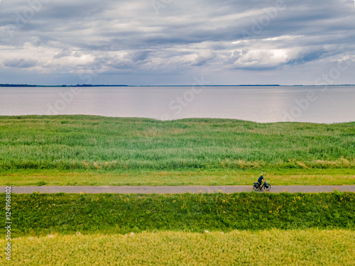 A cyclist on the Baltic Sea Cycle Route on a cloudy day