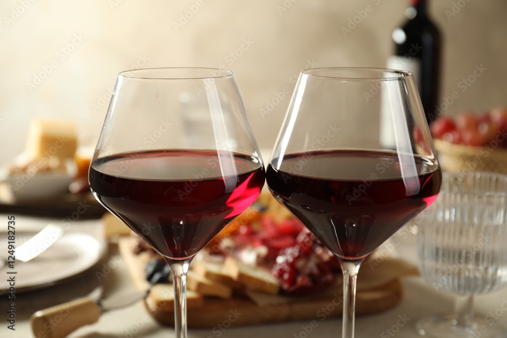 Red wine and different snacks served on table, closeup Red wine and different snacks served on table, closeup