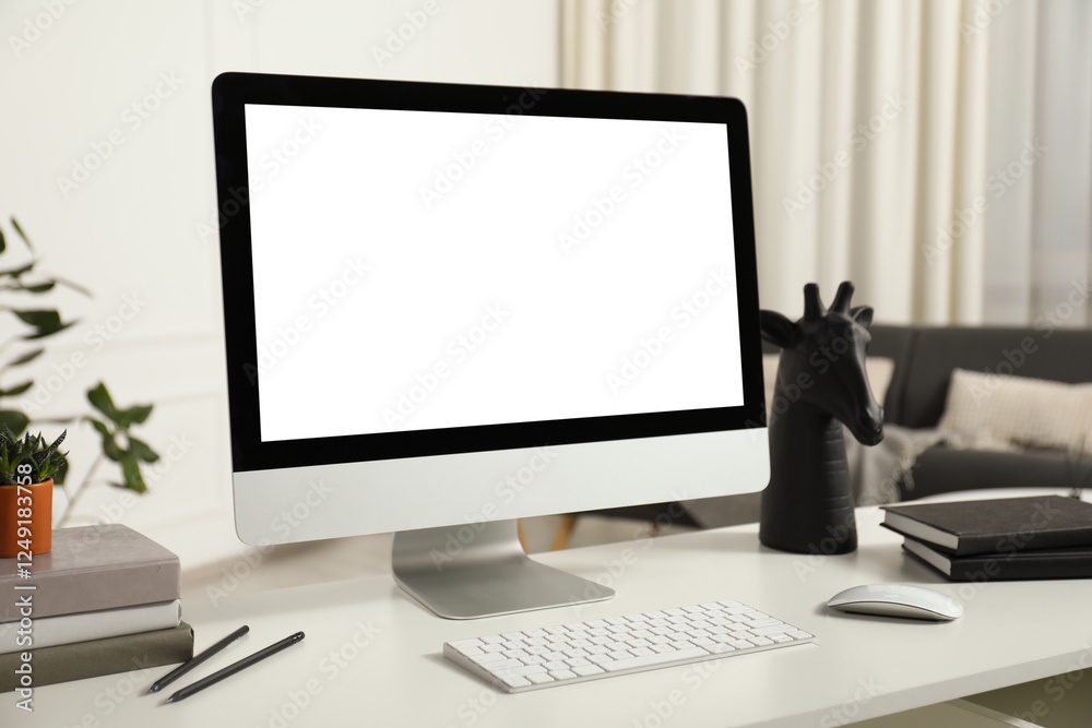 Modern workplace with computer and stationery on white desk indoors Modern workplace with computer and stationery on white desk indoors