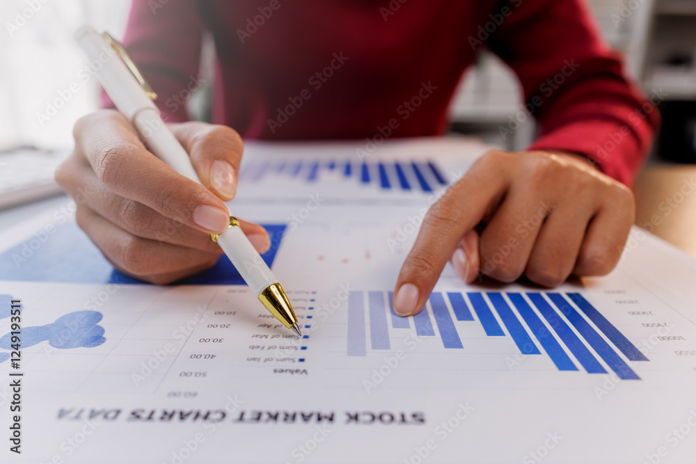 Business hand doing finances accountant working audit inspect calculating expense annual financial report balance sheet statement, making notes checking document and data analysis profit graph Business hand doing finances accountant working audit inspect calculating expense annual financial report balance sheet statement, making notes checking document and data analysis profit graph