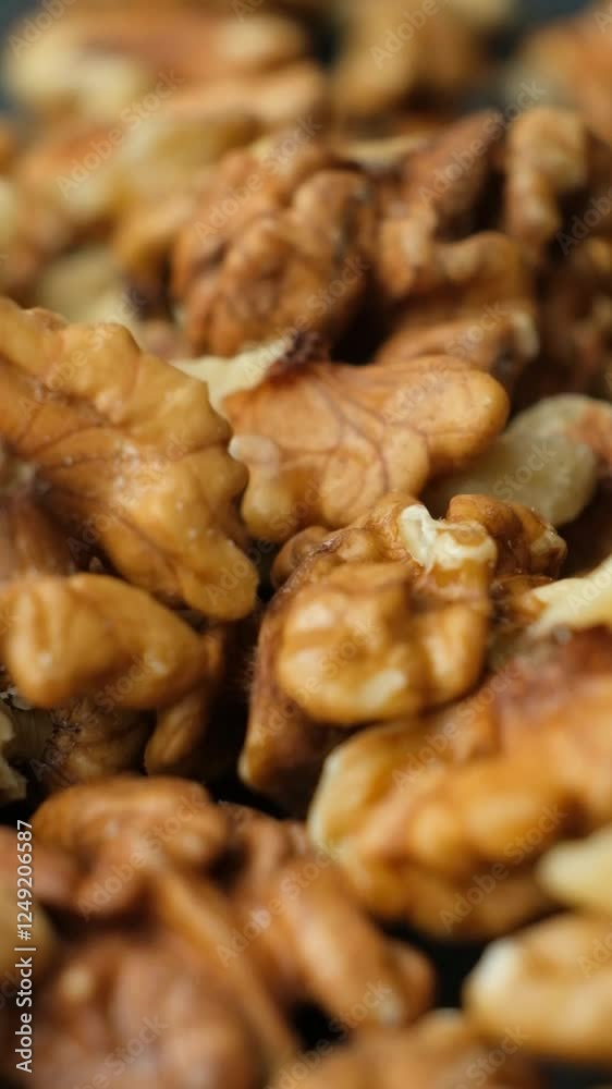 Scattering of peeled walnuts, kernels close-up slow motion. Scattering of peeled walnuts, kernels close-up slow motion.