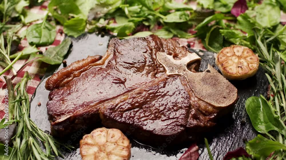 Grilled T-Bone Beef Steak with Greenery Around Grilled T-Bone Beef Steak with Greenery Around