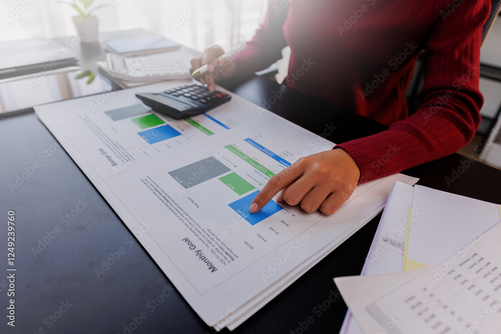 Business accountant or financial expert analyze business report graph and finance chart at corporate office. Concept of finance economy, banking business and stock market research. Business accountant or financial expert analyze business report graph and finance chart at corporate office. Concept of finance economy, banking business and stock market research.