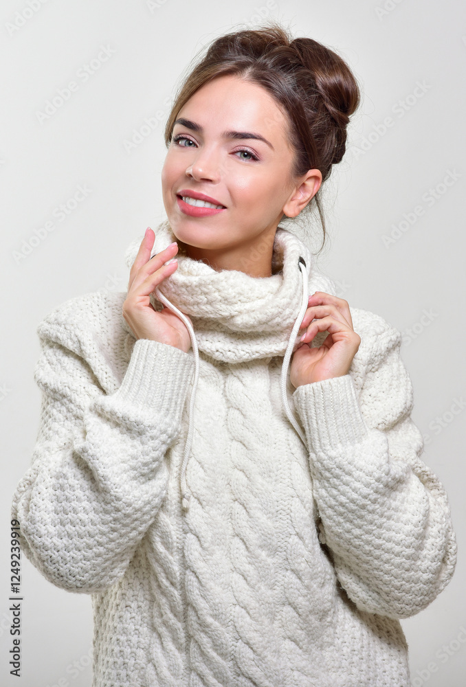 Cheerful woman clothing in warm hat. Winter season. Cheerful woman clothing in warm hat. Winter season.