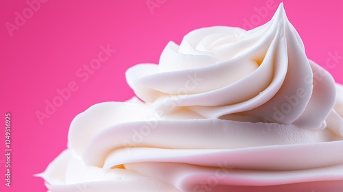 Close Up Whipped Cream Swirl On Pink Background