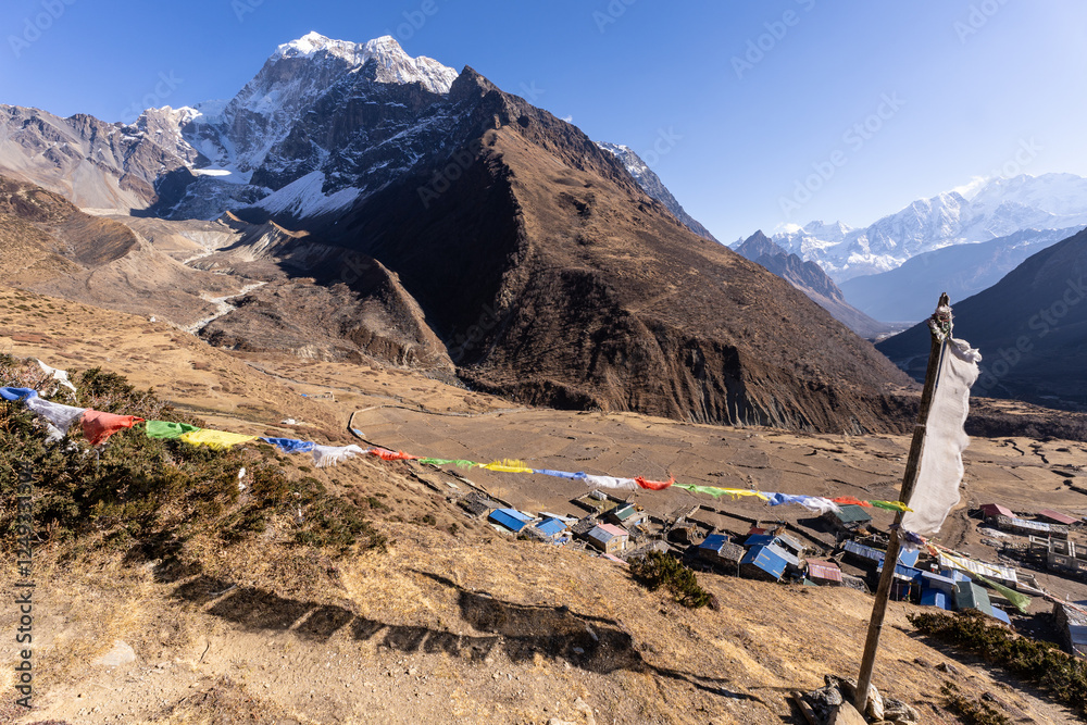 Samdo, Nepal: Tibetan buddhist prayer flags fly above the village of Samdo along the Manaslu circuit trek in the Himalayas in Nepal.