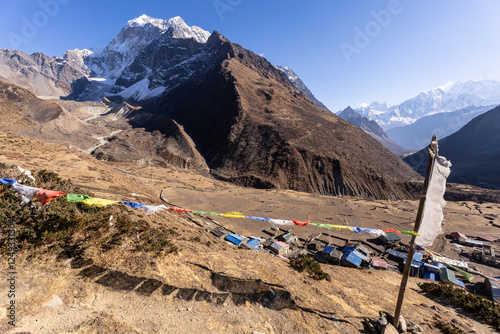 Obraz na płótnie Samdo, Nepal: Tibetan buddhist prayer flags fly above the village of Samdo along the Manaslu circuit trek in the Himalayas in Nepal. w salonie