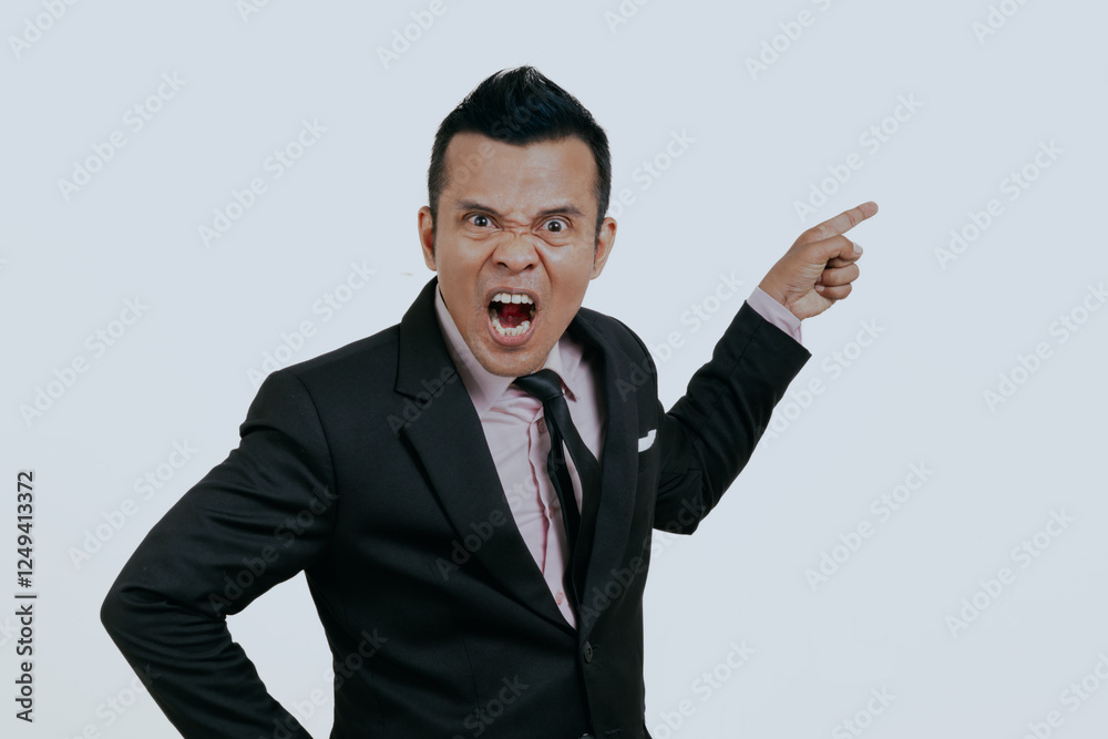 Angry Asian boss manager businessman pointing finger something to empty side, isolated over white background. Angry Asian boss manager businessman pointing finger something to empty side, isolated over white background.