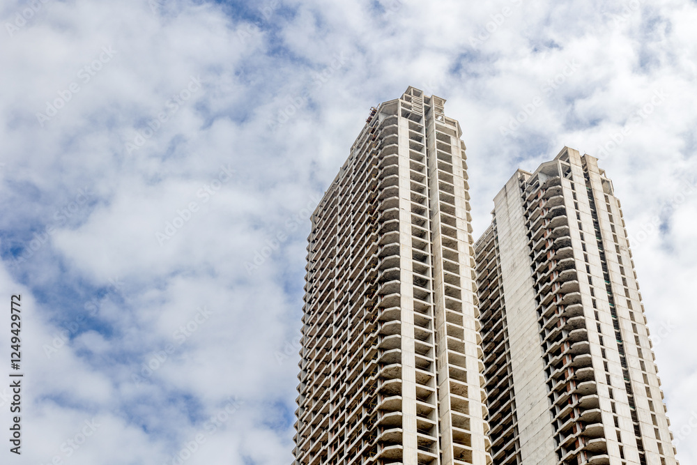 Abandoned high-rise buildings against a cloudy sky Abandoned high-rise buildings against a cloudy sky