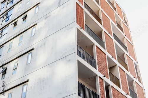 Modern urban apartment building with brick and concrete facade