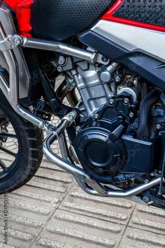 Wallpaper Mural Close-up of motorcycle engine with silver and black detailing on a textured surface Torontodigital.ca