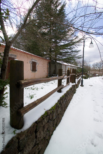 house in the snow in window, Foresta di Badde Salighe- Ortakis Bolotana Bonorva, Sardinia, Italy. photo