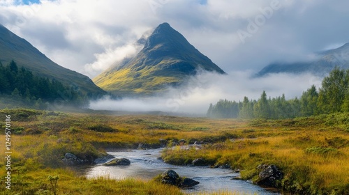 Majestic mountain landscape with flowing stream in the early morning mist