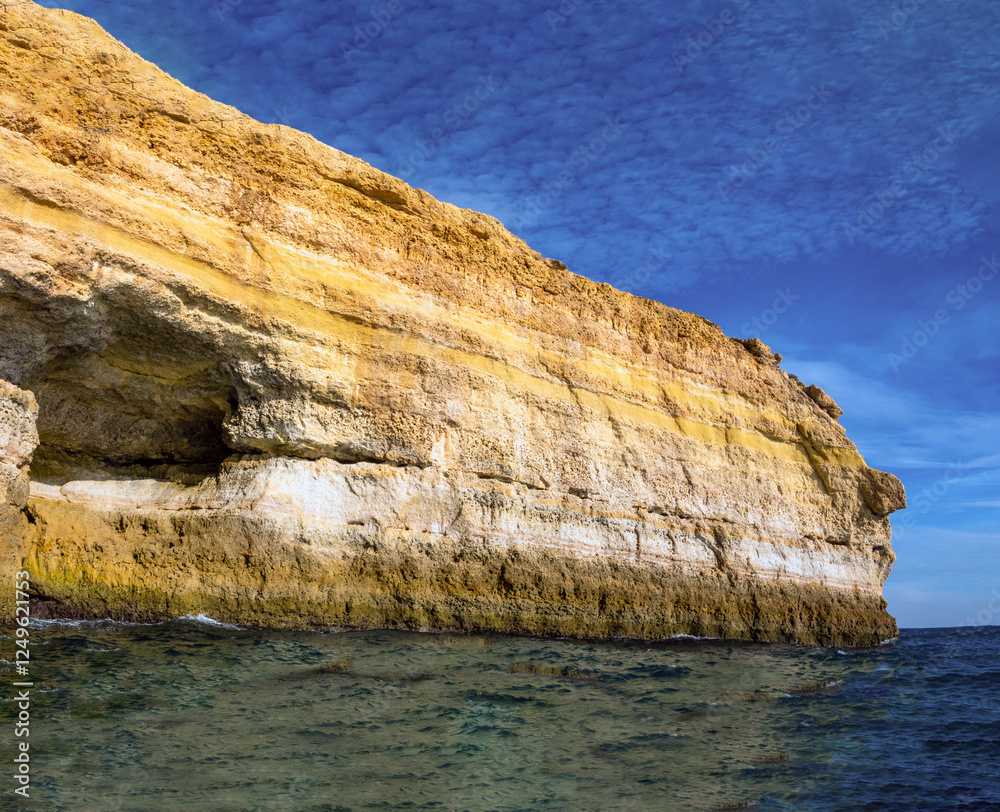 Stunning cliffs and caves along the Algarve coastline near Benagil, Portugal