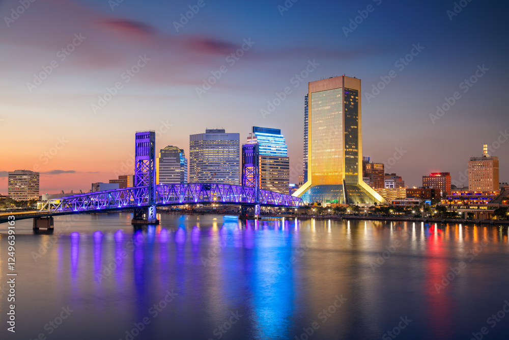Jacksonville, Florida, USA. Cityscape image of Jacksonville, Florida with reflection of the city skyline in the water at beautiful sunset.