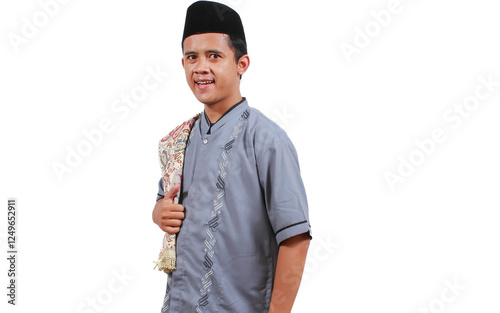 smiling asian muslim man wearing grey Koko clothes during Eid Al Fitr isolated on white background photo