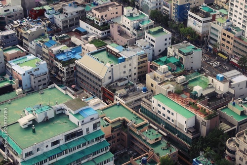 Aerial View of a Dense Urban Neighborhood in Busan, South Korea, Featuring Colorful Rooftops, Narrow Streets, and Residential and Commercial Buildings