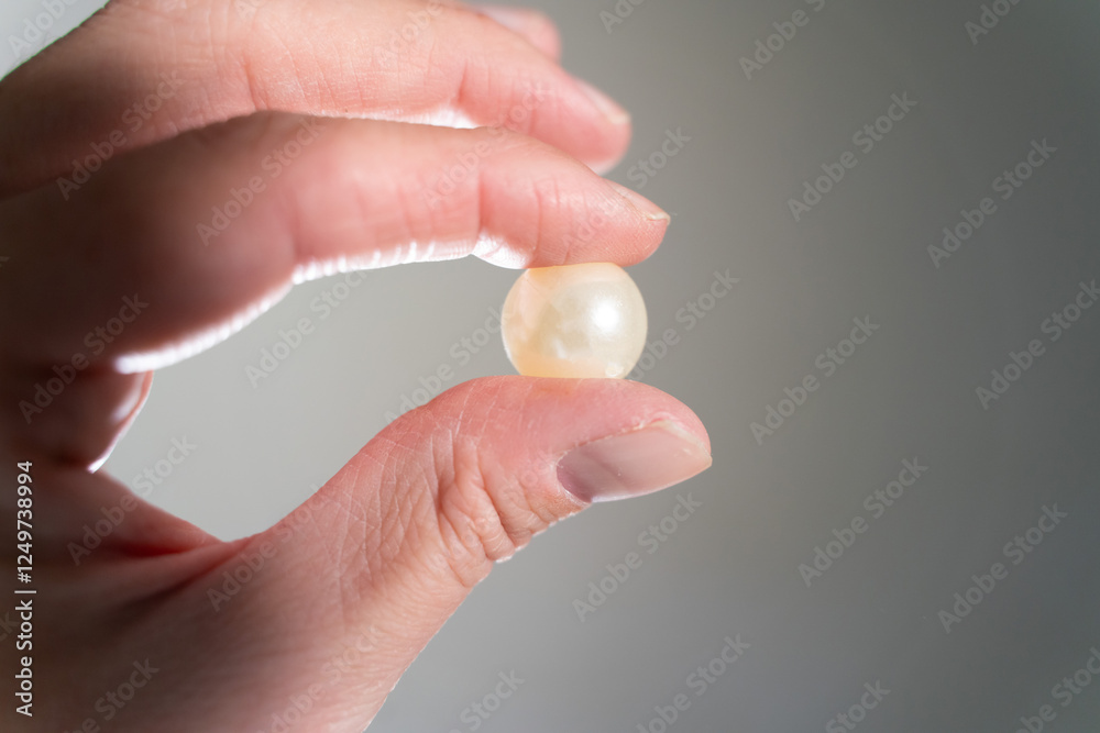 Big precious pearl in hand close-up Big precious pearl in hand close-up