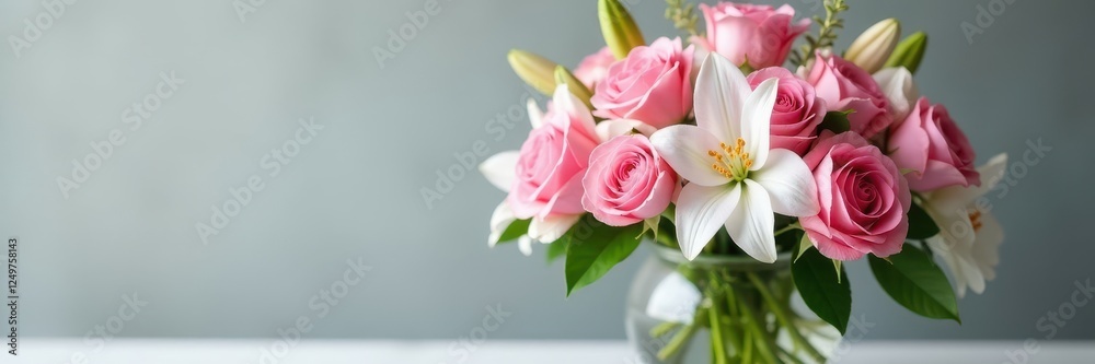Dense floral arrangement of pink roses and white lilies in a modern vases, elegant, roses, botanical Dense floral arrangement of pink roses and white lilies in a modern vases, elegant, roses, botanical