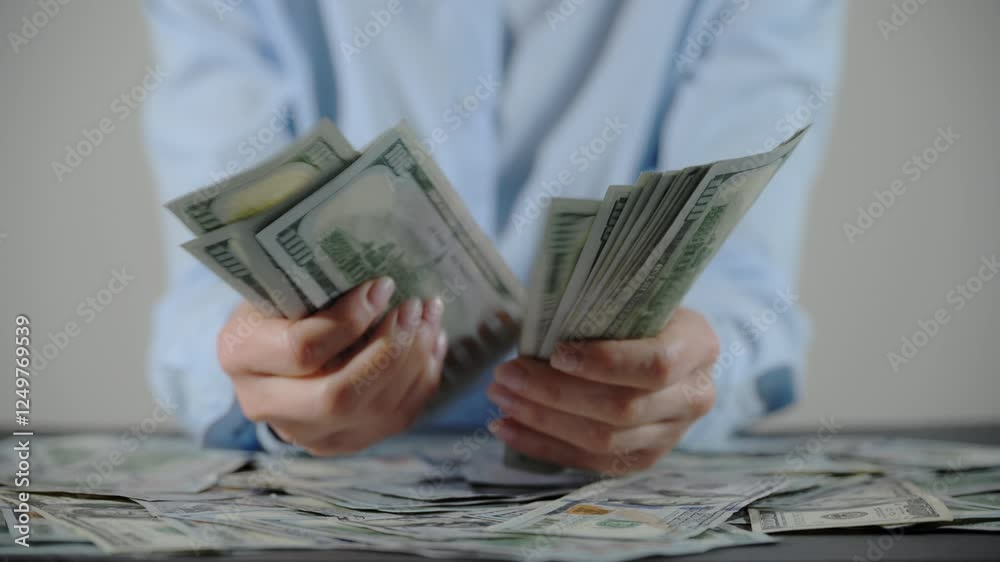 Female hands counting one hundred dollar bills and passing stock to man hand. Close up