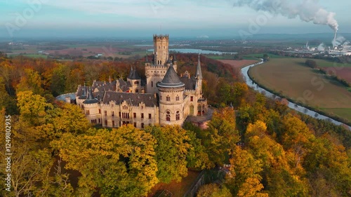 Aerial drone view of medieval castle Marienburg in forest on hill near Hanover in Lower Saxony, Germany. High quality 4k footage