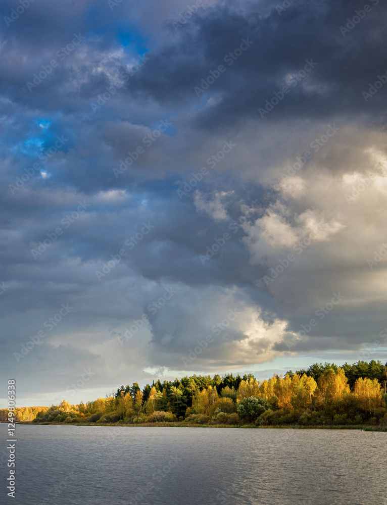 Cloudy sky with a lake in the background Cloudy sky with a lake in the background