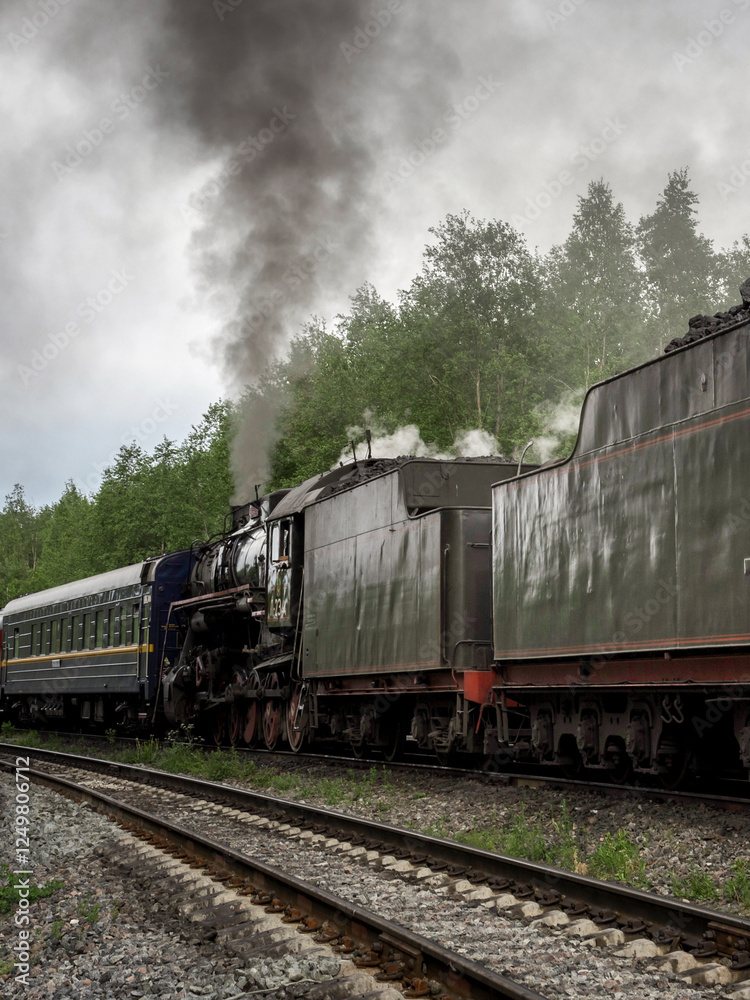 Fototapeta premium Train with smoke coming out of it