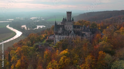 Aerial drone view of medieval castle Marienburg in forest on hill near Hanover in Lower Saxony, Germany. High quality 4k footage