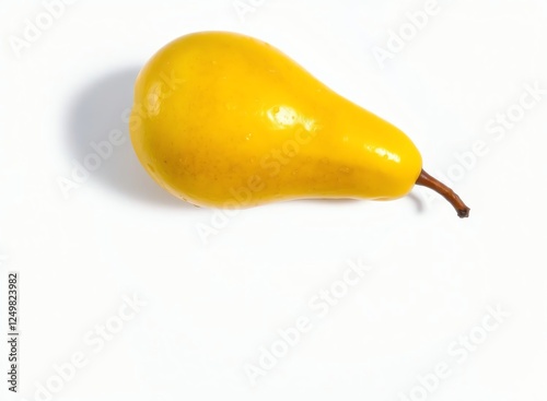 an image of a yellow pear on a white surface, a close up of a yellow pear on a white surface photo