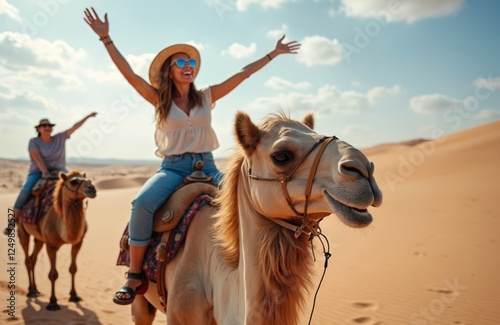 Happy woman tourists enjoy camel ride tour in Morocco desert. Group of female holidaymakers fun on camels in sunny day. Excited, cheerful. Outdoor adventure in North Africa. Cultural exploration