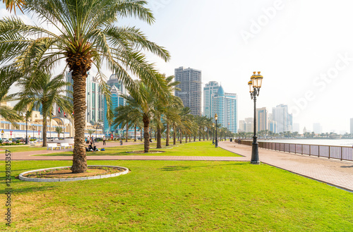 Canvas Print The Sharjah downtown skyline, and the Blue Souk Central Market and Park along the seaside corniche at Sharjah, United Arab Emirates