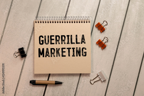 Text sign showing guerilla marketing. The text is written on a small wooden blackboard.